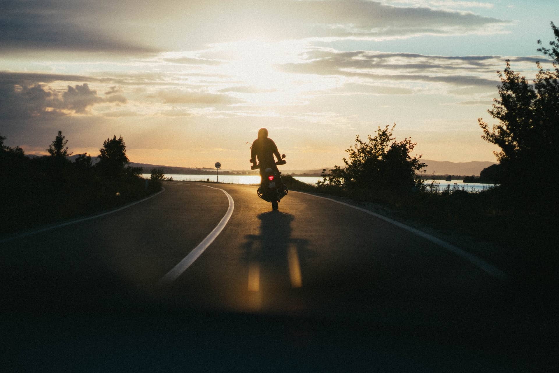 motorcycle riding down a road